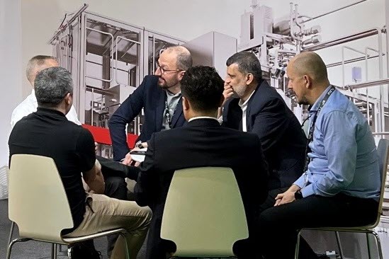 People holding a meeting during a fair